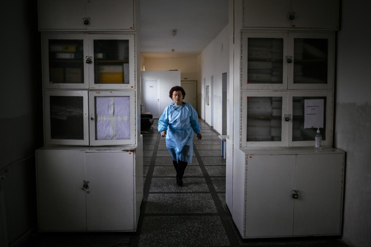 This picture taken on January 20, 2021 shows Bulgarian Infection disease specialist Dr Maria Bogoeva, 82, taking a short break during her shift in a Covid-19 unit in the hospital of Doupnitsa, a municipality with 50,000 inhabitants which is desperately la