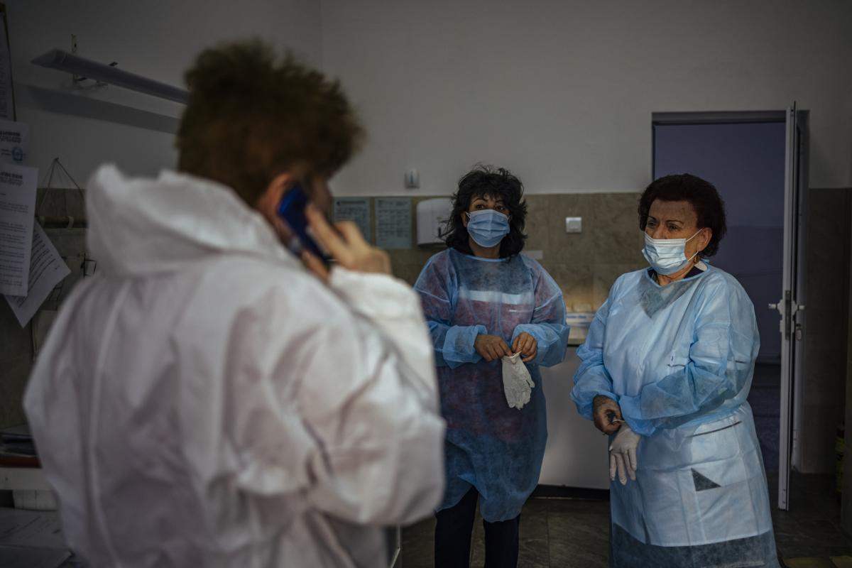 This picture taken on January 20, 2021 shows Bulgarian Infection disease specialist Dr Maria Bogoeva, 82, taking a short break during her shift in a Covid-19 unit in the hospital of Doupnitsa, a municipality with 50,000 inhabitants which is desperately la