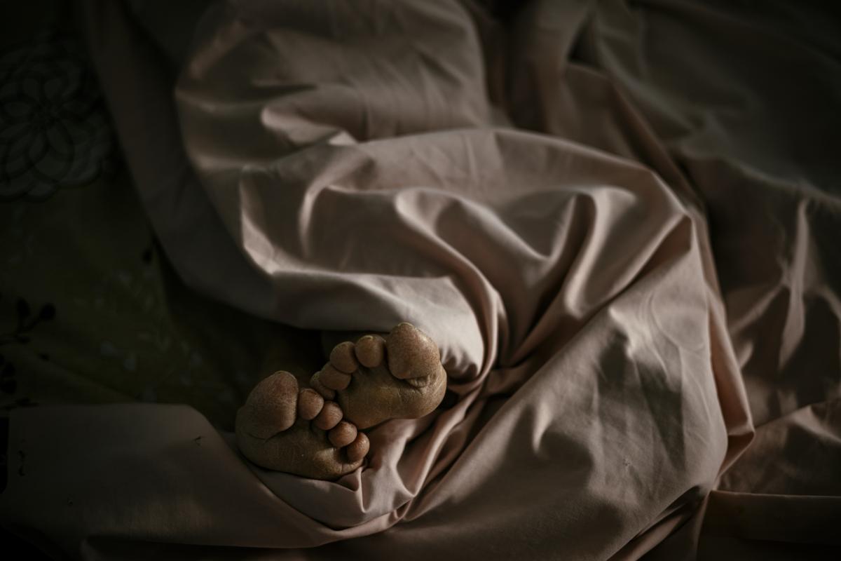 This picture taken on January 20, 2021 shows Bulgarian Infection disease specialist Dr Maria Bogoeva, 82, taking a short break during her shift in a Covid-19 unit in the hospital of Doupnitsa, a municipality with 50,000 inhabitants which is desperately la