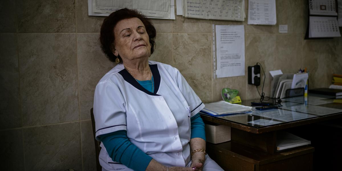 This picture taken on January 20, 2021 shows Bulgarian Infection disease specialist Dr Maria Bogoeva, 82, taking a short break during her shift in a Covid-19 unit in the hospital of Doupnitsa, a municipality with 50,000 inhabitants which is desperately la