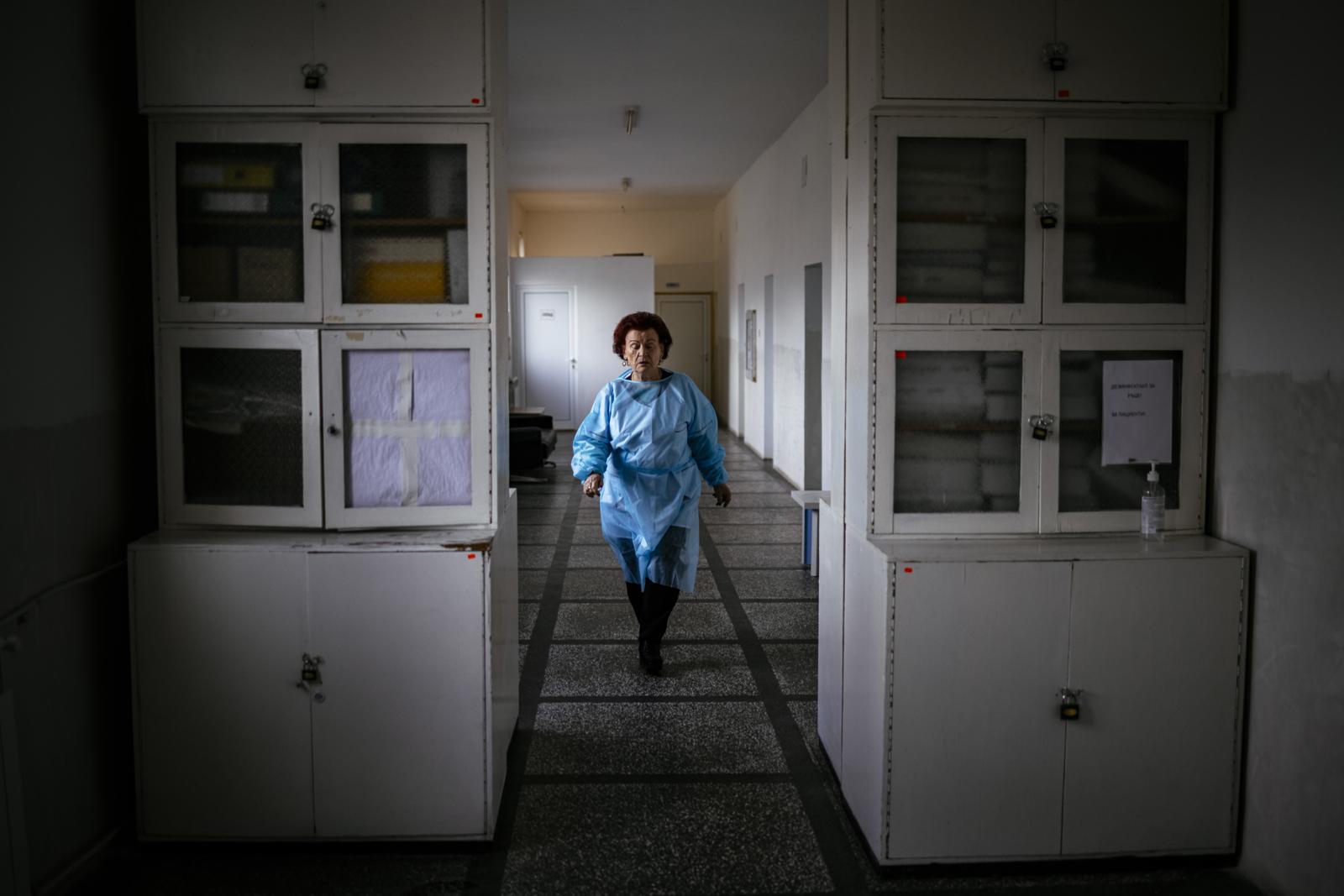 This picture taken on January 20, 2021 shows Bulgarian Infection disease specialist Dr Maria Bogoeva, 82, taking a short break during her shift in a Covid-19 unit in the hospital of Doupnitsa, a municipality with 50,000 inhabitants which is desperately la