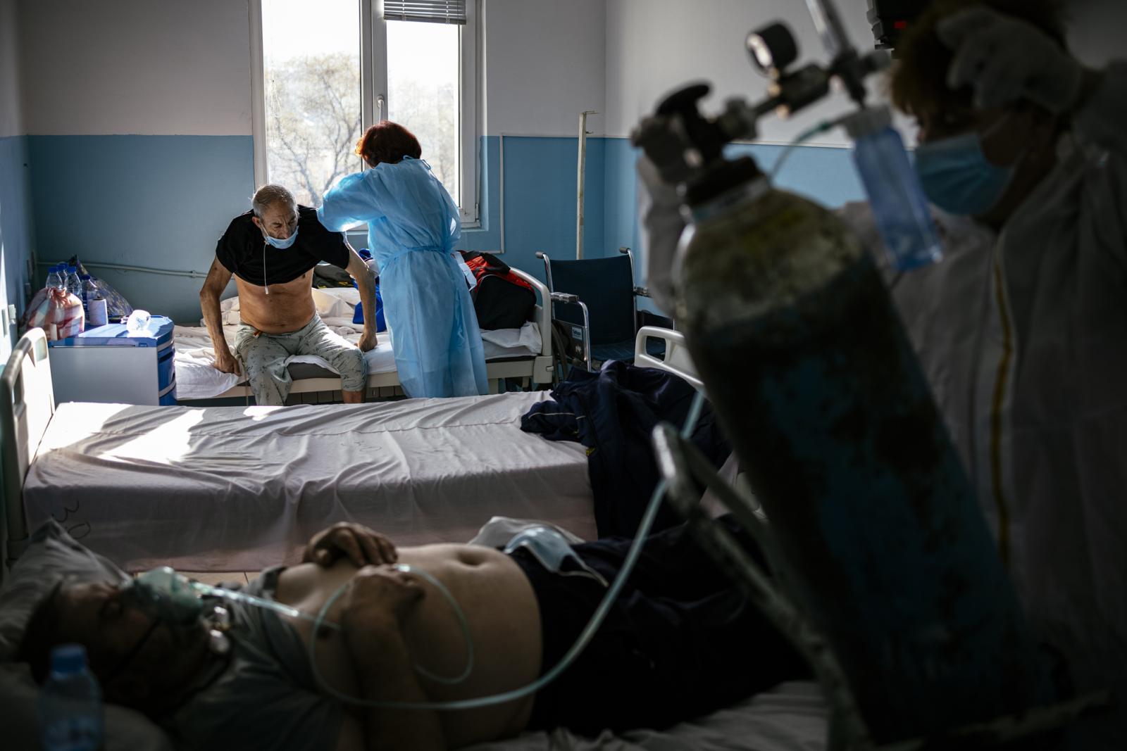 This picture taken on January 20, 2021 shows Bulgarian Infection disease specialist Dr Maria Bogoeva, 82, taking a short break during her shift in a Covid-19 unit in the hospital of Doupnitsa, a municipality with 50,000 inhabitants which is desperately la