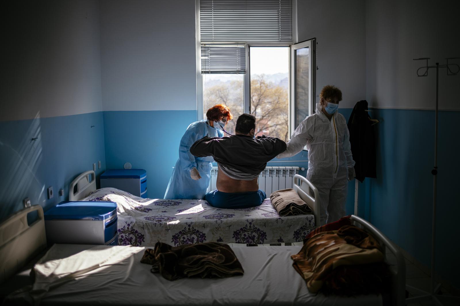 This picture taken on January 20, 2021 shows Bulgarian Infection disease specialist Dr Maria Bogoeva, 82, taking a short break during her shift in a Covid-19 unit in the hospital of Doupnitsa, a municipality with 50,000 inhabitants which is desperately la