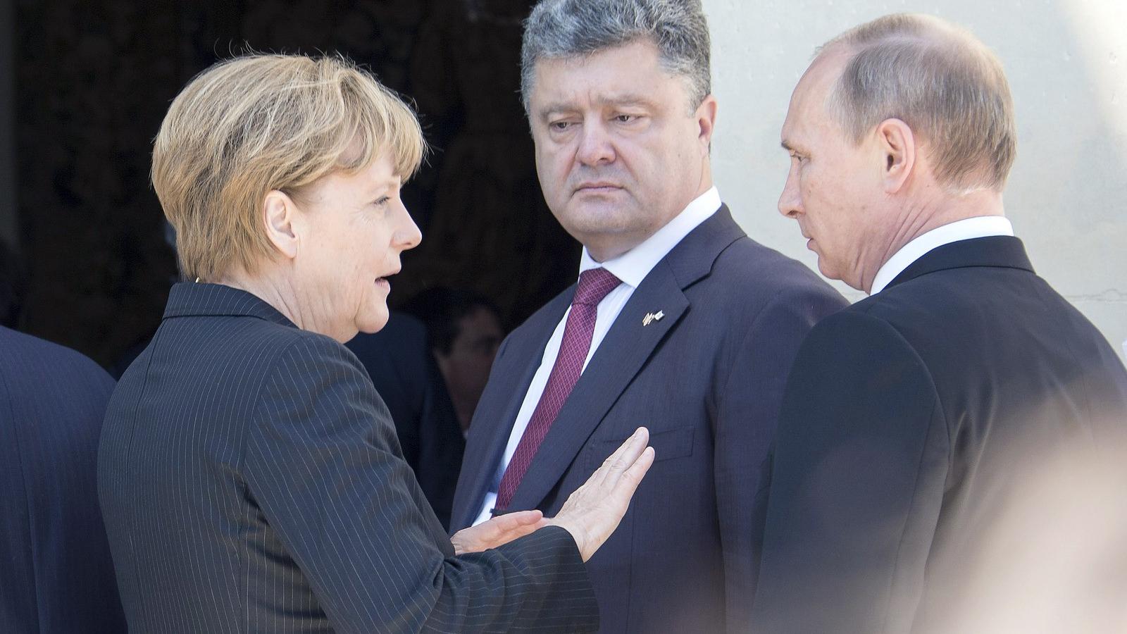 Angela Merkel német kancellár, Vlagyimir Putyin orosz elnök és Petro Porosenko megválasztott ukrán elnök Fotó: Getty Images